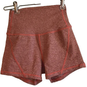 Born Primitive burnt orange women’s size XS workout fitted shorts.